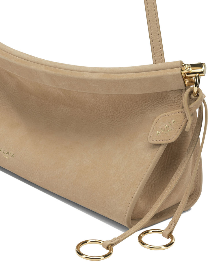 AlaïA Le Click East West Shoulder Bags - Beige | 2a385da12cc14513aff6e13ae888177a52b49837