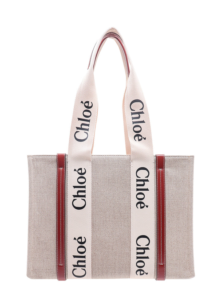 Linen shoulder bag with logo print.  This bag is made with lower environmental impact material