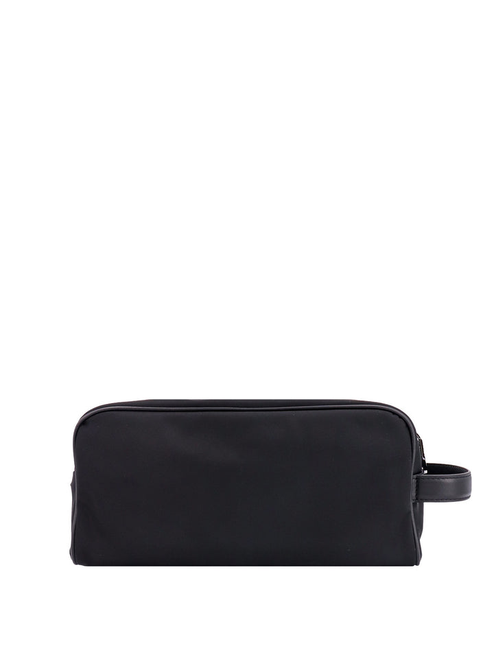 Leather beauty case with metal logo patch