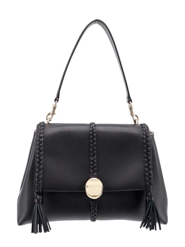 Leather shoulder bag with tassels