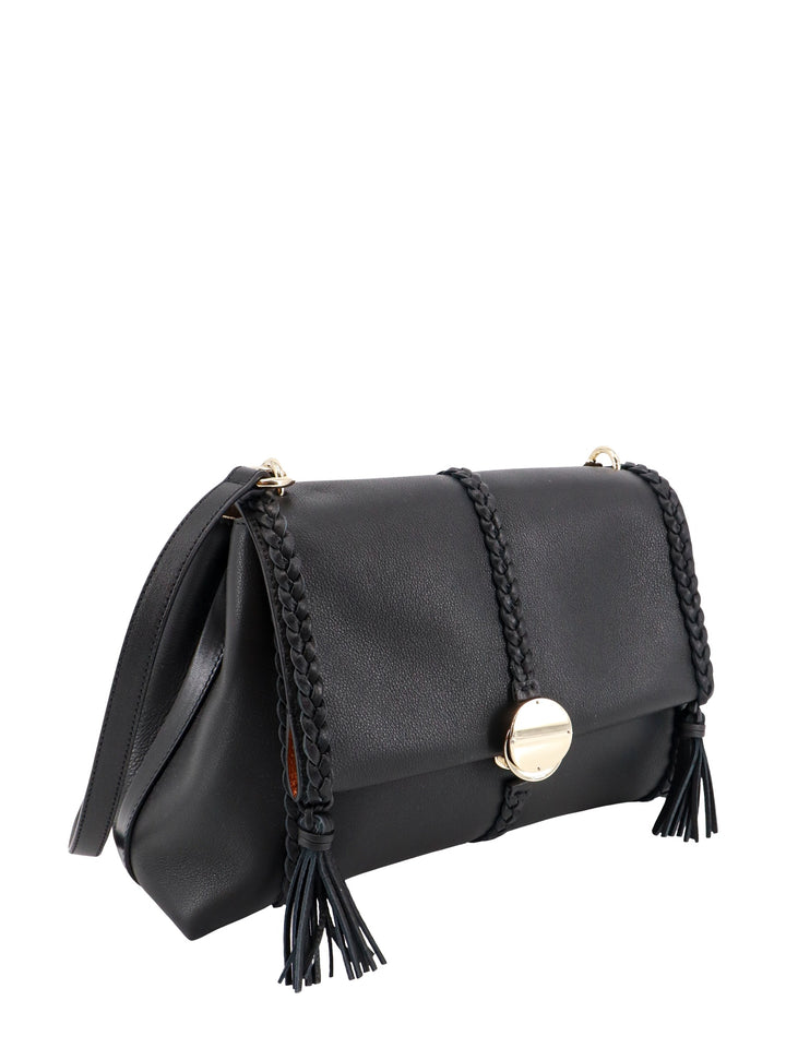 Leather shoulder bag with tassels