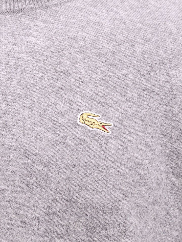 Wool sweater with embroidered Lacoste patch