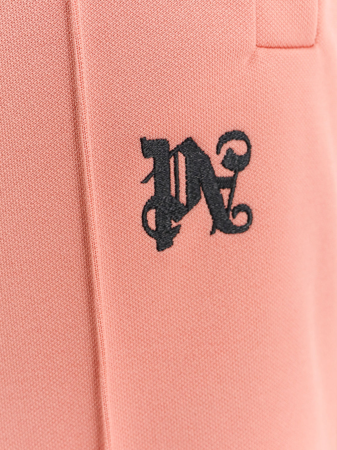 Trouser with embroidered monogram on the front