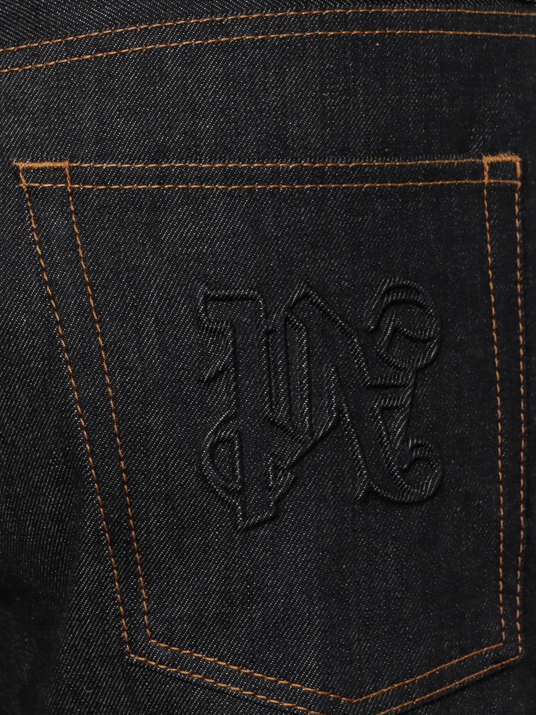 Cotton jeans with embossed monogram on the back