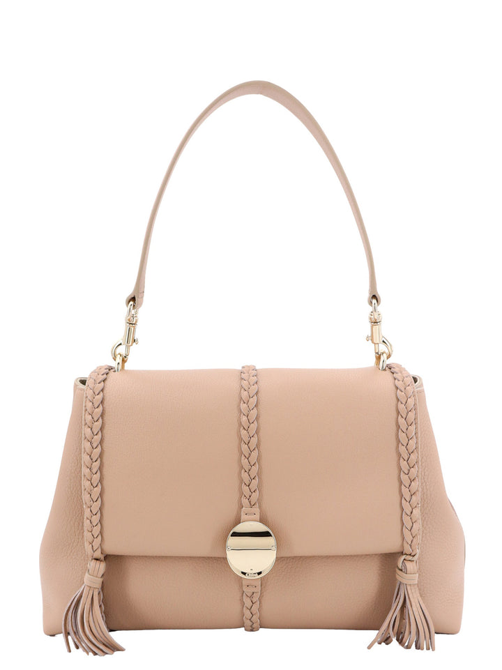 Leather shoulder bag with tassels