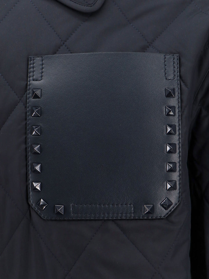 Padded and quilted nylon jacket with iconic studs