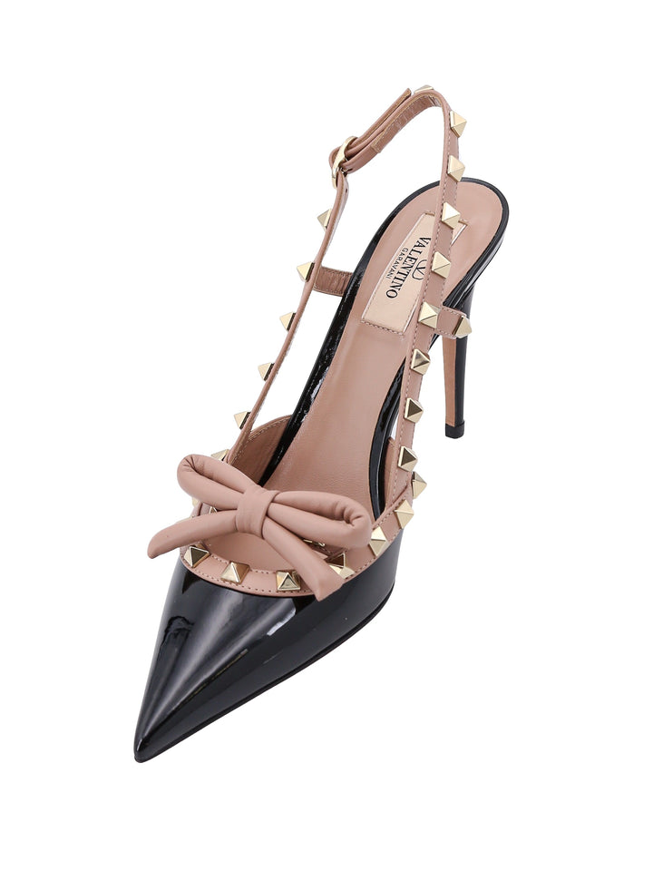 Patent leather slingback with iconic studs