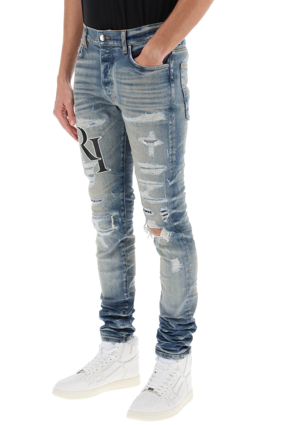 Destroyed Jeans With Staggered Logo - Amiri - Men