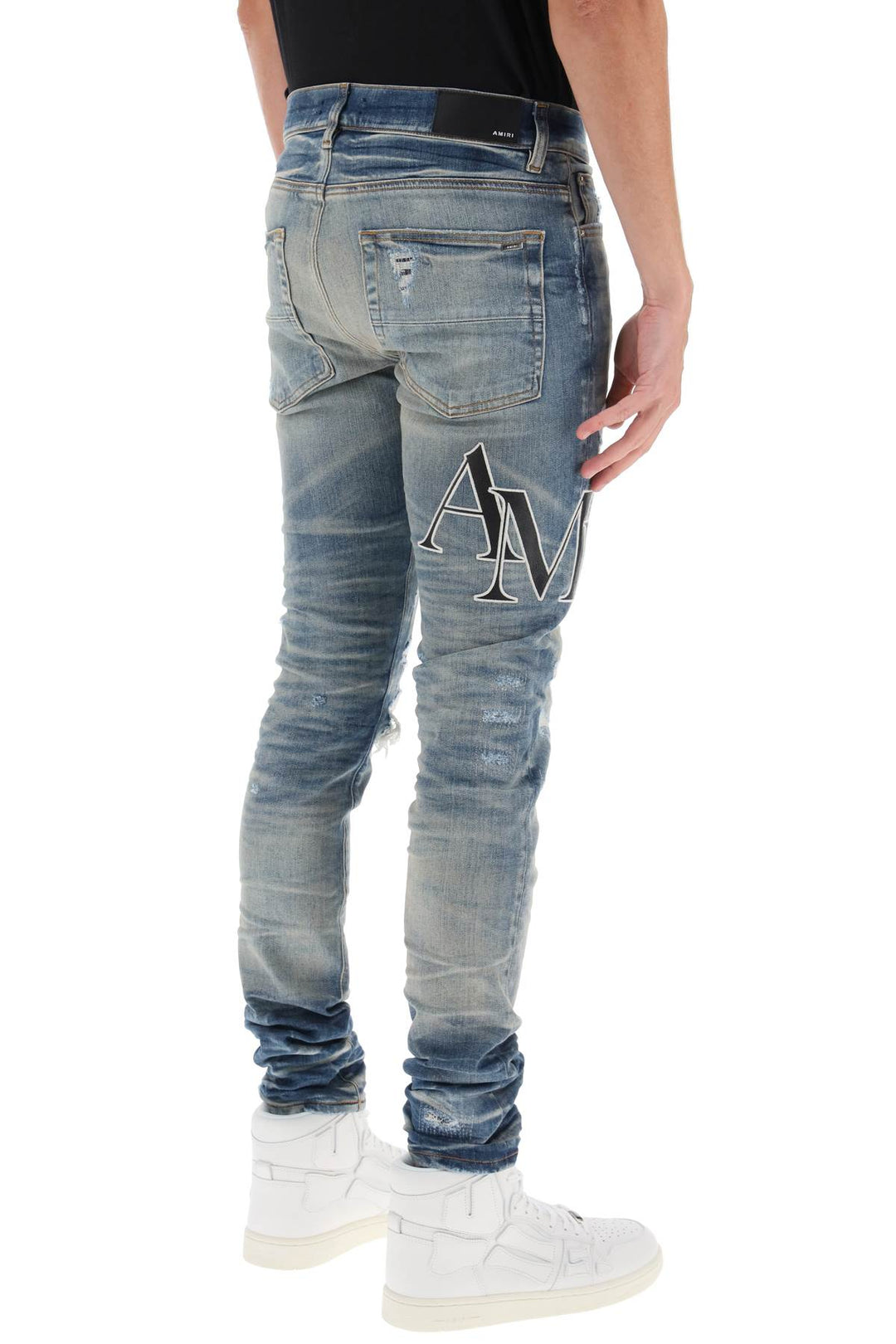 Destroyed Jeans With Staggered Logo - Amiri - Men