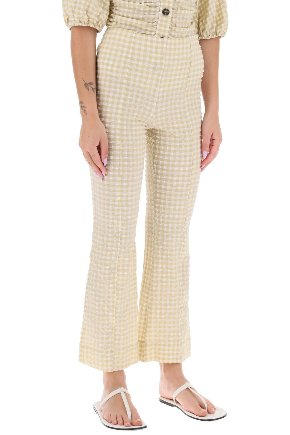 Shop Ganni Flared Pants With Gingham Motif