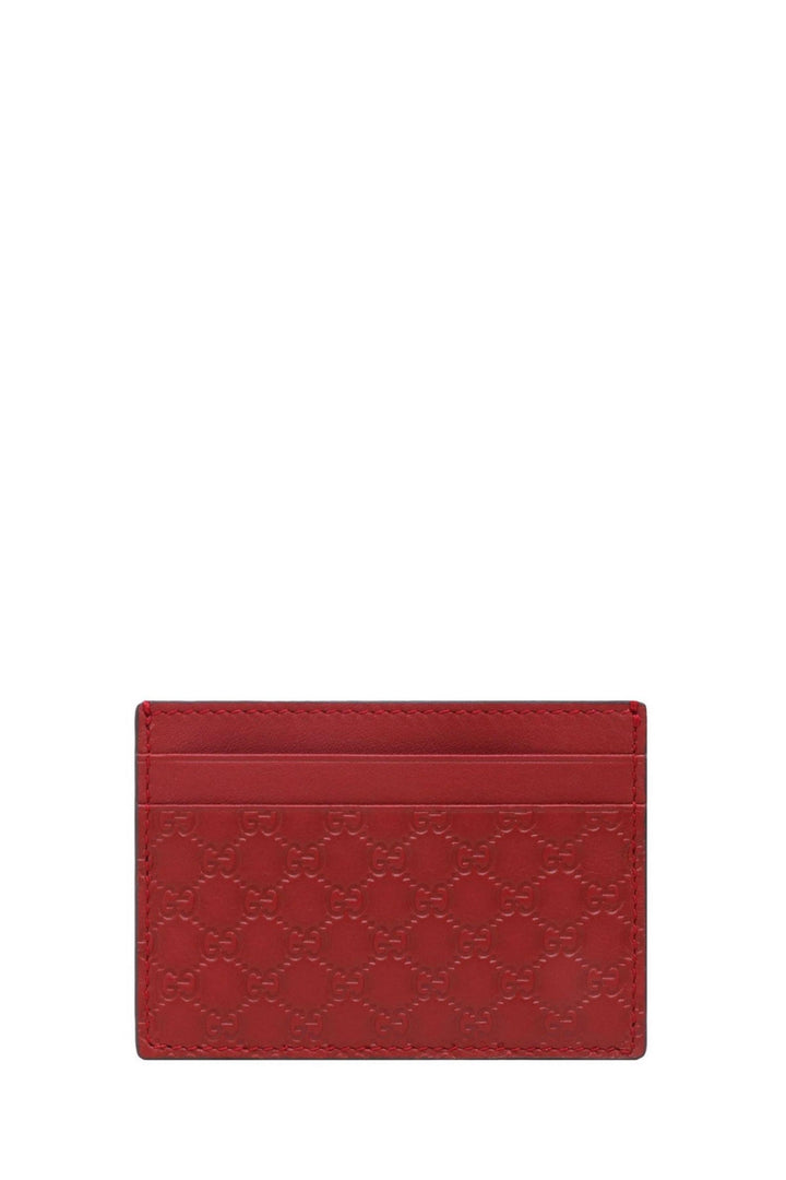 Red leather card holder with embossed GG motif