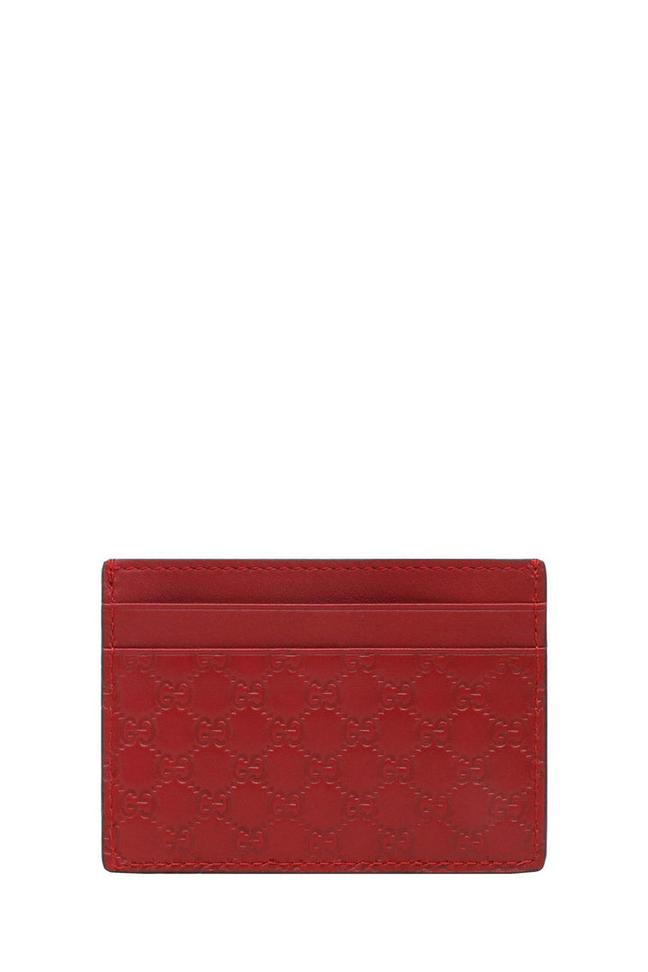 Red leather card holder with embossed GG motif